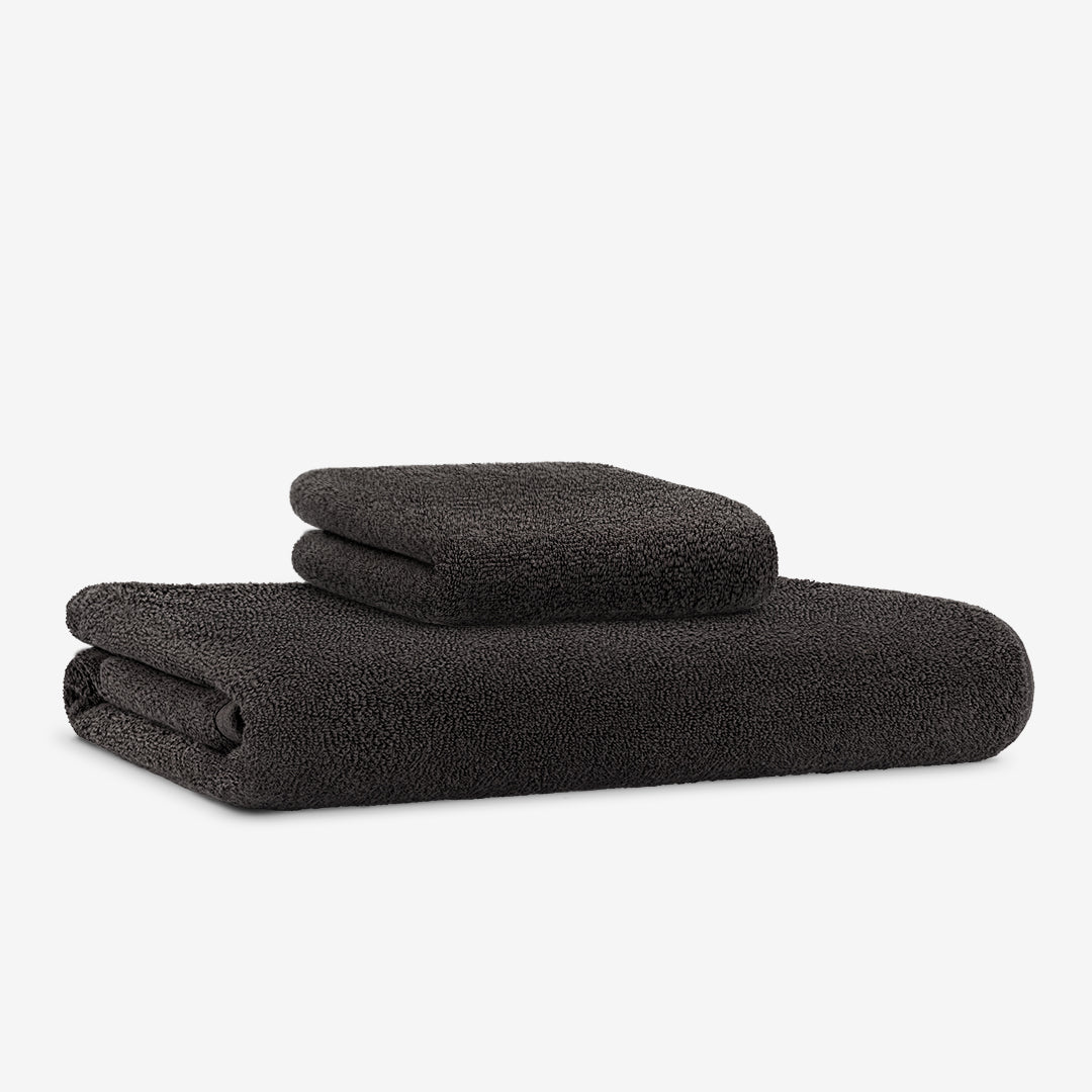 https://sojitowel.com/cdn/shop/products/1-Bath-1-Hand-Towel-Black.jpg?v=1623170190